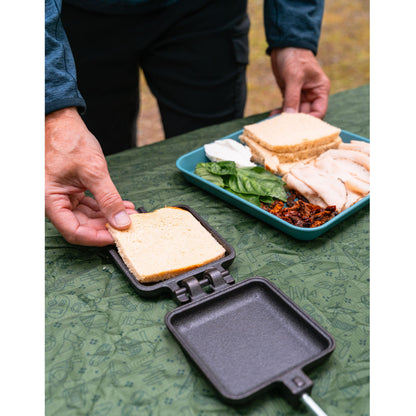 Coghlan's Cast Iron Camp Cooker - Pre-Seasoned Pie Iron Sandwich Maker with Heat-Resistant, Removable Handles, Easy-to-Clean for Toasted Pies, Grilled Sandwiches, and Meats, For Campfire Cooking